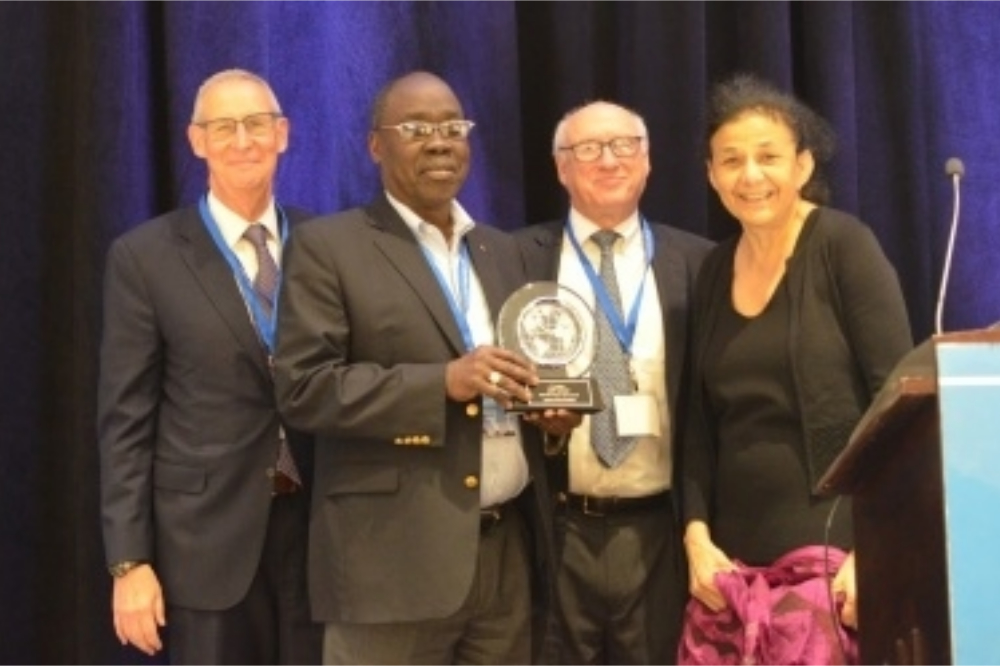 Dr. Hakim (second from left), is joined by (L-R) Drs. Carl Dieffenbach, Myron Cohen, and Wafaa El-Sadr