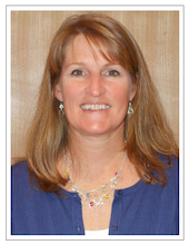 Photo of Beth Farrell, Associate Director of Finance. She is blonde and wearing a blue shirt with silver jewelry.